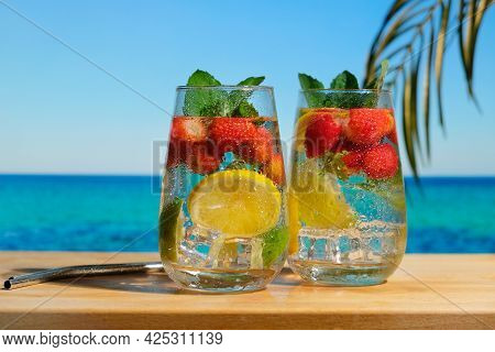 Summer Cocktails, Beach Bar Concept. Hard Seltzer Cocktail With Strawberry, Lemon And Mint. Chilled 