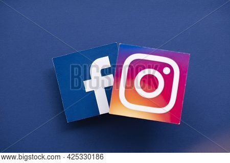 London, Uk - June 2021: Facebook And Instagrm Logos Printed Onto Paper