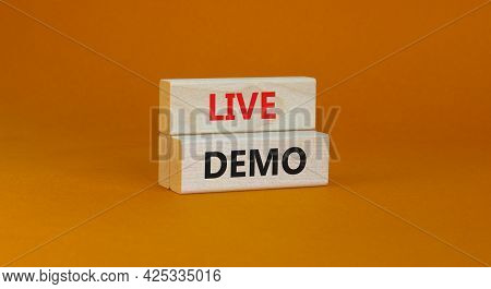 Live Demo Symbol. Concept Words 'live Demo' On Wooden Blocks On A Beautiful Orange Background. Copy 