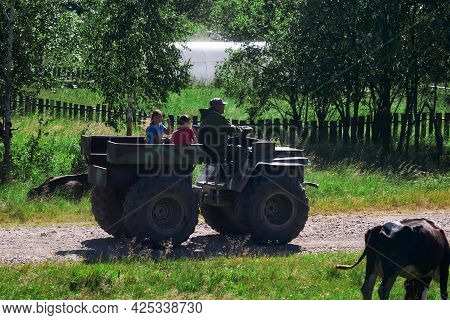 Cape, Russia - June 20, 2021: Villagers Rides A Makeshift Swamp Buggy Through The Village