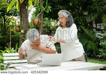 Elderly Asian Men Are Choking On Drinking Water. Tight, Suffocating In The Neck And Chest Area. His 