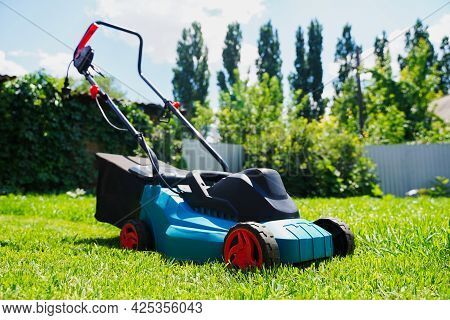 Lawnmower Electric Machine Trimming Green Grass. Lawn Cutting