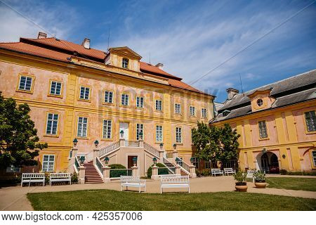 Krasny Dvur Chateau, North Bohemia, Czech Republic, 19 June 2021: Baroque Yellow Castle With Stairs,