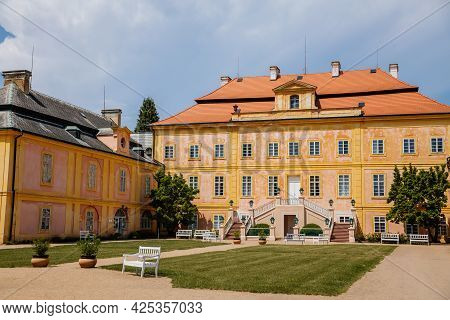 Krasny Dvur Chateau, North Bohemia, Czech Republic, 19 June 2021: Baroque Yellow Castle With Stairs,