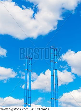 Blue Tpp Pipes On The Background Of The Sky And Clouds