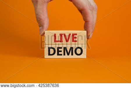 Live Demo Symbol. Concept Words 'live Demo' On Wooden Blocks On A Beautiful Orange Background. Busin