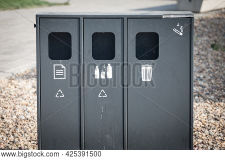 Selective Blur On A Recycling Trash Can Where You Can Separate Your Metal, Glass, And Plastic Garbag