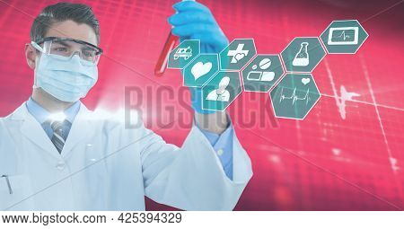 Digital medical icons against caucasian male doctor wearing face mask holding a test tube. medical research and science technology concept