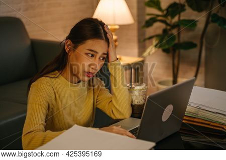 Frustrated Young Asian Female Entrepreneur With Hands On Head Feeling Irritated, Tired And Tensed Wh