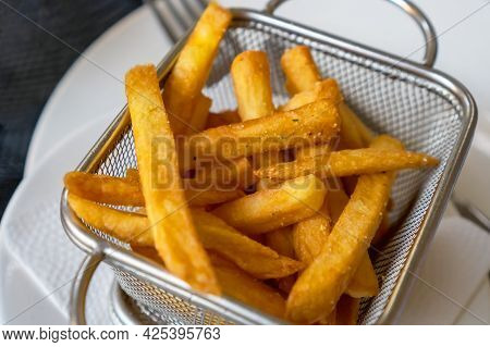 Delicious French Fries, Sprinkled With Spices In A Metal Dish