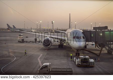 The Aircraft Is Attached To The Terminal Gangway Of The Airport Building While Refueling Before The 