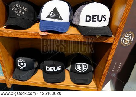 Sète , Ocitanie France  - 06 30 2021 : Deus Different Caps For Sale In The Store With Text Logo And 