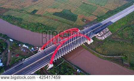 Aerial View Of The Kalikuto Bridge, An Iconic Red Bridge At Trans Java Toll Road, Batang When Sunris