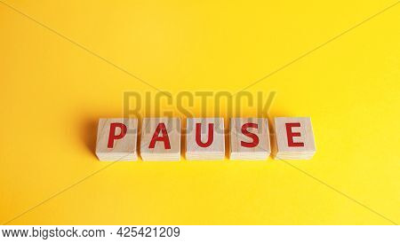 Wooden Blocks With The Word Pause. Break Time Concept. A Break During Work. Time To Relax And Rechar