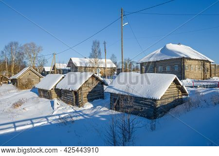 Wooden Old Bathhouses On The Banks Of The Churyega River On A Frosty February Day. Village Of Pogost