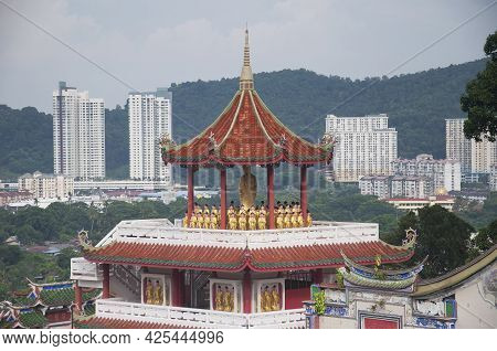 A Gazebo With Many Buddha Statue Within The Kek Lok Si Temple In Penang Malaysia On A Sunny Blue Sky