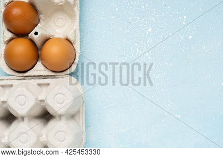 Eggs In Eco Package On Blue Cement Background.zero Waste Cconcept. Package-free Food Shopping. Top V