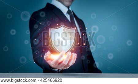 Businessman Holding Shield Protect Icon For Internet Firewall, Insurance, Or Computer Virus Cleaner.