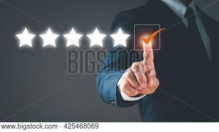 The Man Touching The Virtual Screen On The Gap With A 5-star Symbol To Give Satisfaction In Service.