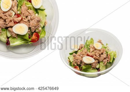 Fresh Tuna Salad With Lettuce, Cucombers, Cherries And Eggs In Plastic Container.  Top View.