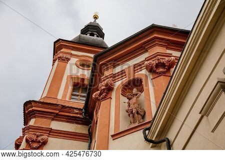 Valec, Western Bohemia, Czech Republic, 19 June 2021:  Baroque Red And Yellow Church Of The Holy Tri