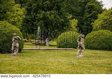 Valec, Western Bohemia, Czech Republic, 19 June 2021:  English Park With Tall Trees And Green Lawn, 