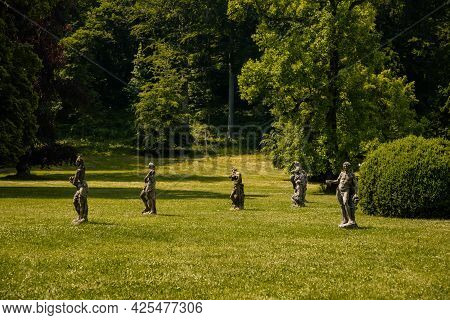 Valec, Western Bohemia, Czech Republic, 19 June 2021:  English Park With Tall Trees And Green Lawn, 