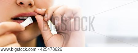 Woman Chewing Wet Moist Nicotine Tobacco Snus Product