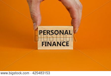 Personal Finance Symbol. Wooden Blocks With Words Personal Finance On Beautiful Orange Background, C