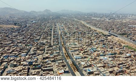 Aerial View Of The District Of San Martin De Porres And The Rimac River Located North Of The Capital