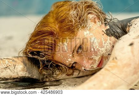 Smiling Seductive Bodypainting Portrait Of A Sexy Young Redhead Woman With Dots Of White, Red And Bl