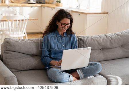 Happy Smiling Young Woman Messaging With Friend Using Laptop Laugh Reading Email Or Chat Message On 