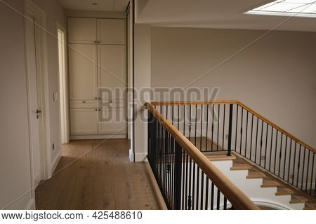General view of house interior with spacious hallway and staircase. modern interiors and house decoration concept.