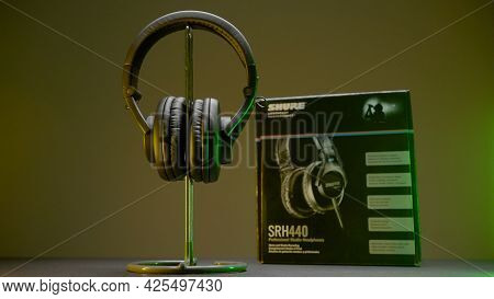 Russia, Moscow - May 5, 2021: New Headphones On Table. Action. New Model Of Headphones With Packagin