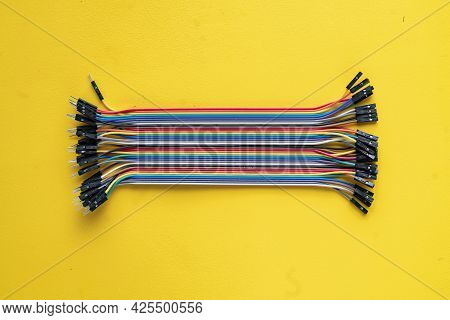 Bunch Of Electronic Wires Or Caples In Colorful Isolation On The Table, Connection Concept