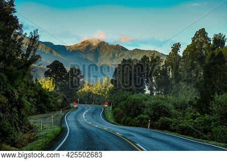 The Winding West Coast Road  At The Base Of The Southern Alps Through Rain Forest Terrain Between La