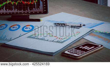 Preparing Report. Green And Red Graphs And Charts. Business Reports And Pile Of Documents On Ash Woo