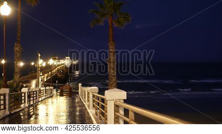 Rain Drops, Evening Dark Sky With Clouds, Oceanside California Usa. Empty Pier And Palm Trees In Twi