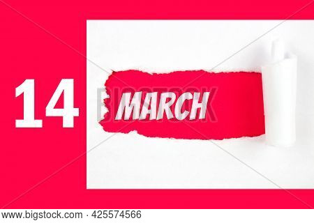 March 14th. Day 14 Of Month, Calendar Date. Red Hole In The White Paper With Torn Sides With Calenda