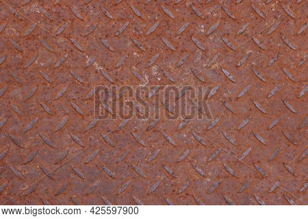 Background Texture Of Rusty Corroded Weathered Industrial Anti Slip Embossed Metal Steel Plate Surfa