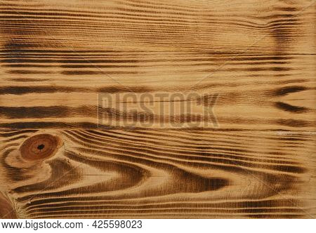 Close Up Background Texture Of Vintage Weathered Burnt And Brushed Pine Wood Surface With Knots And 
