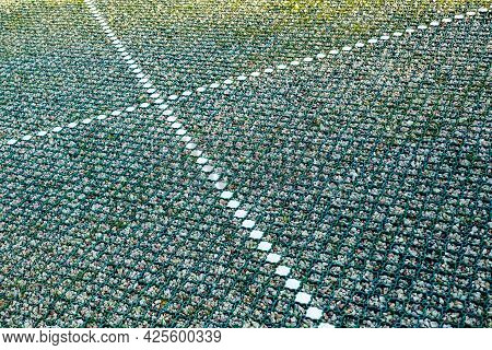New Modern Car Park Gravel Base With A Installed Green Plastic Grid