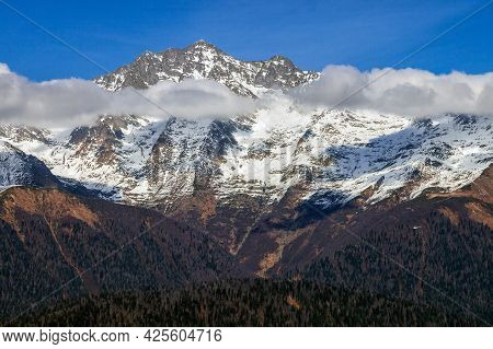 Beautiful Scenic Blue Sky Sunny Autumn Landscape Of Snowy Chugush Mountain Peak In Caucasus Nature R