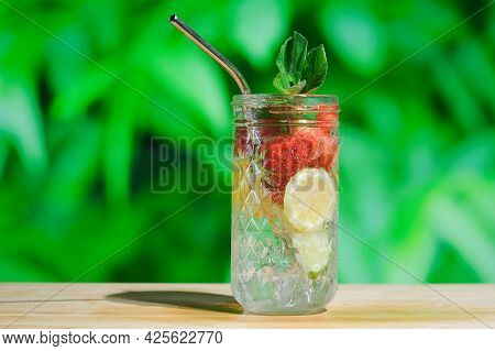 Summer Cocktails, Refreshing Drinks Concept. Drinking Glass Of Hard Seltzer Cocktail With Strawberry