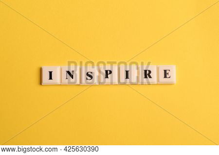 Square Letters With Text Inspire Isolated On Yellow Background