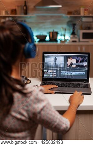Filmmaker Editing Video Footage In Home Using Modern Technology. Content Creator In Home Working On 
