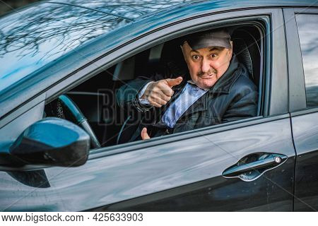 Drunk And Crazy Senior In Automobile. Mature Older Man Lifestyle