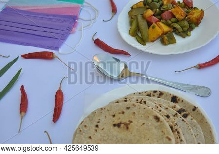 Indian Food: Mix Veg Of Matar Paneer And Shimla Mirch Recipe With Chapati (roti) And Face Mask Over 