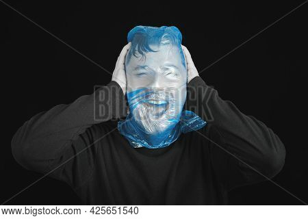 Blue Garbage Bag On Man Head. Exit Bag For Suicide. Self-asphyxiation Concept. Suicide Bag On Man He