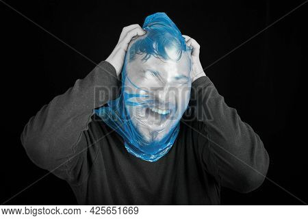 Suicide Bag On Man Head. Exit Bag For Suicide. Self-asphyxiation Concept. Garbage Bag On Head. Short